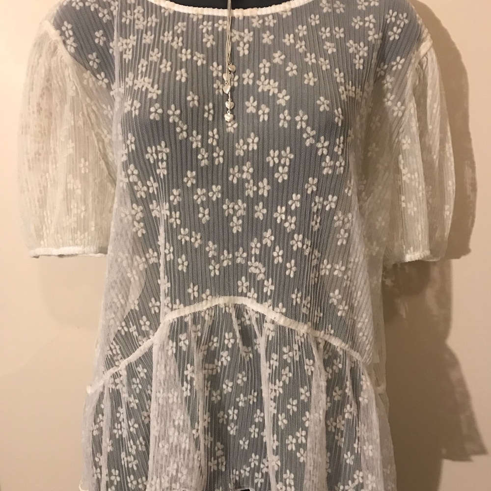 Cream sheer shell with small flower detail